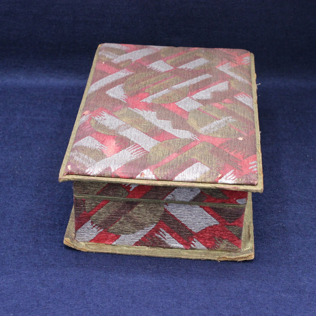 Decorative chocolate box with geometric pattern on a blue background