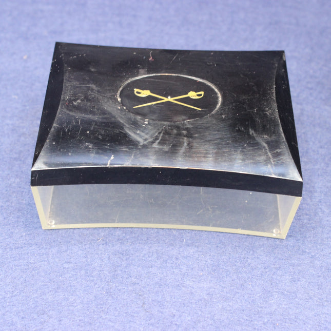 Black and clear rectangular box with a logo on a blue background