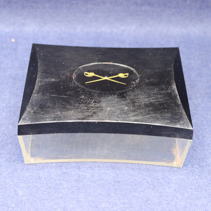 Black and clear rectangular box with a logo on a blue background