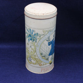 Decorative candle tin with intricate designs on a dark blue background