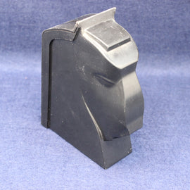 Black plastic component on a blue background