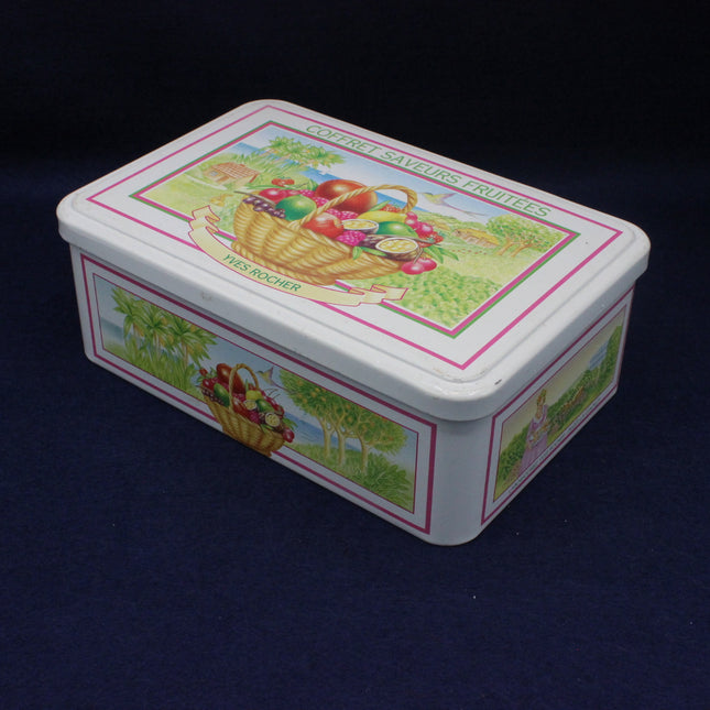 Decorative tin box with colorful design on a dark background
