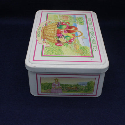Decorative tin box with colorful graphics on a dark background