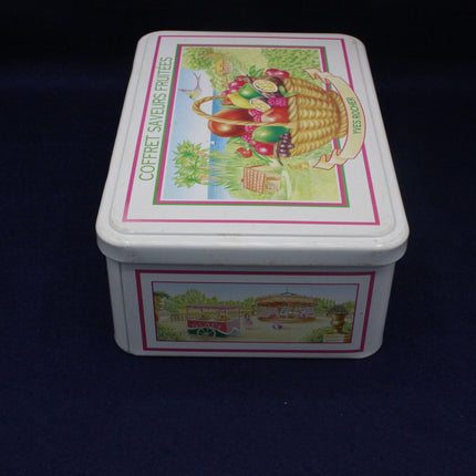 Vintage tin box with decorative lid featuring illustrations on a dark background