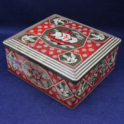 Decorative red and silver box with intricate patterns on a blue background