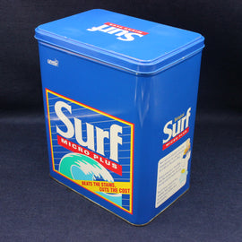 Blue vintage Surf Micro Plus cleaning product container on a dark background