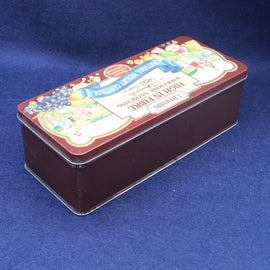 Decorative rectangular tin box with colorful label on a blue background