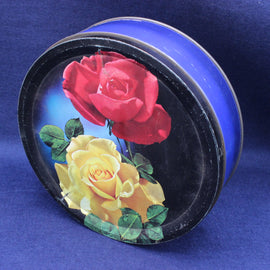 Biscuit Tin with red and yellow roses on a blue background