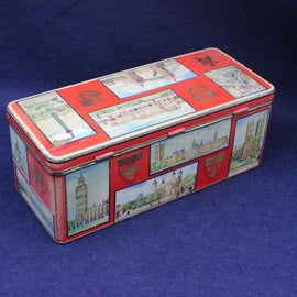 Rectangular tin box with colorful designs on a blue background