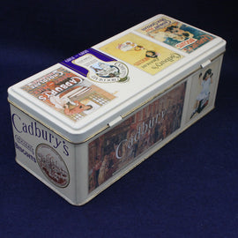 Cadbury's biscuit tin with vintage-style packaging on a dark blue background
