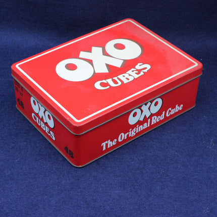 Red OXO Cubes tin on a blue background