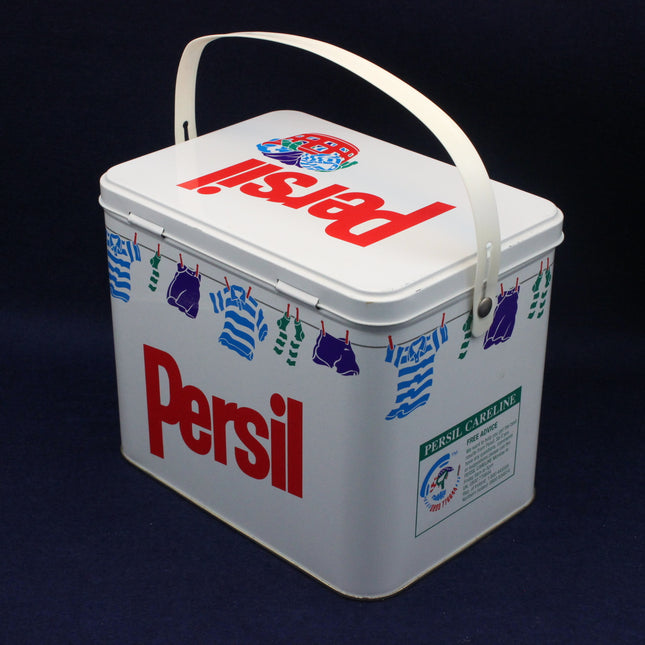 Vintage Persil laundry detergent container with clothesline design on a dark background