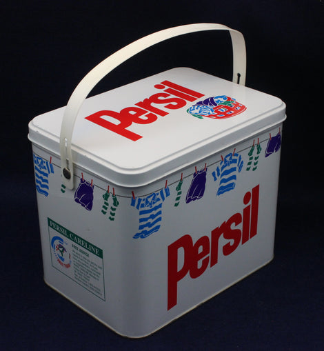 Vintage Persil laundry detergent container with clothesline design on a black background