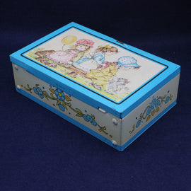 Decorative box with a colorful illustration of children on a blue background