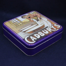 Cadbury's chocolate tin with vintage illustration on a dark background