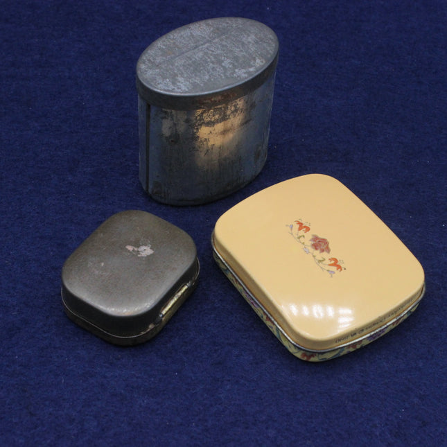 Three pill boxes on a blue background