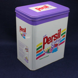Vintage Persil Colour laundry detergent canister with purple lid on a dark background
