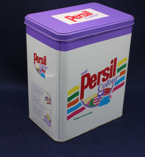 Vintage Persil Colour laundry detergent canister with purple lid on a dark background