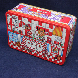 OXO vintage metal storage tin with colorful design on a dark blue background