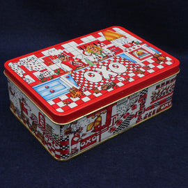 Decorative rectangular tin box with colorful graphics on a dark background