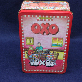 OXO vintage metal storage tin with cartoon design on a blue background