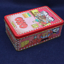 Colorful rectangular tin box with cartoon design on a blue background