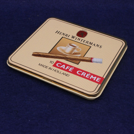 Pack of Henri Wintermans Cafe Creème cigarettes on a blue background
