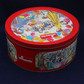 Round tin with colorful design and 'Whitworths' branding on a dark background