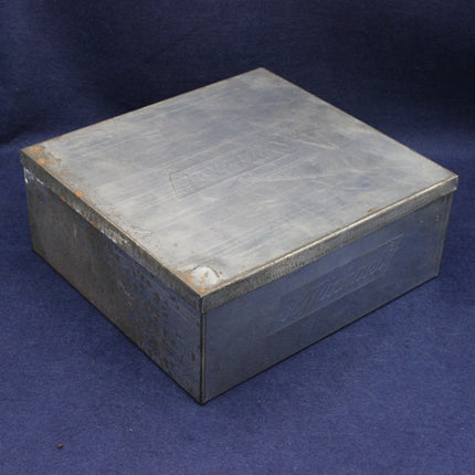 Metal Biscuit Tin on a blue background