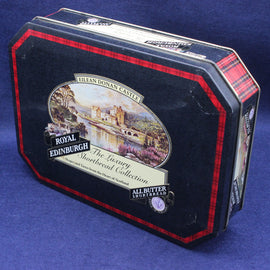 picture of Eilean Donan Castle on a black tin