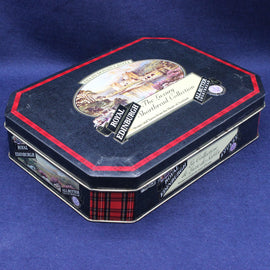 Decorative metal tin with 'Royal Edinburgh' branding on a blue background