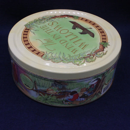 Round tin with colorful design and text on a dark background