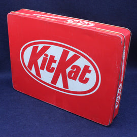 Red KitKat tin box on a blue background