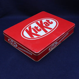 Red Kit Kat chocolate box on a dark blue background
