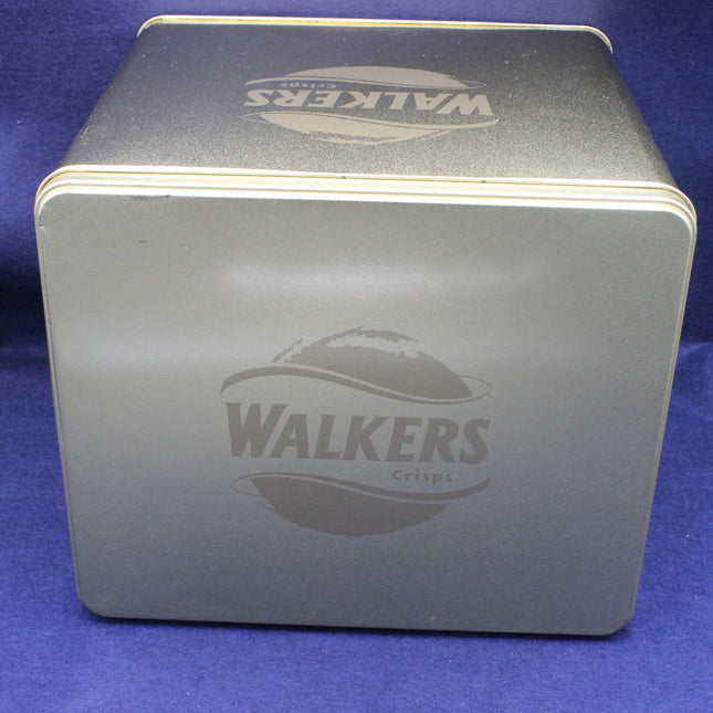 Square metal tin with 'Walkers' branding on a blue background
