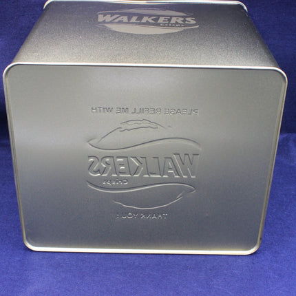 Gold rectangular tin with 'Walkers' branding on a blue background
