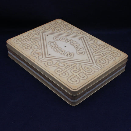 Custard cream cookies biscuit tin on a dark blue background
