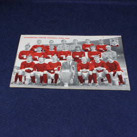 Vintage photo of Manchester United football club team with a trophy on a blue background