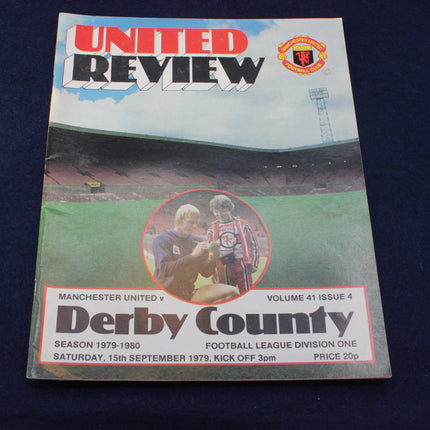 Football match programme for Manchester United vs Derby County on a dark background