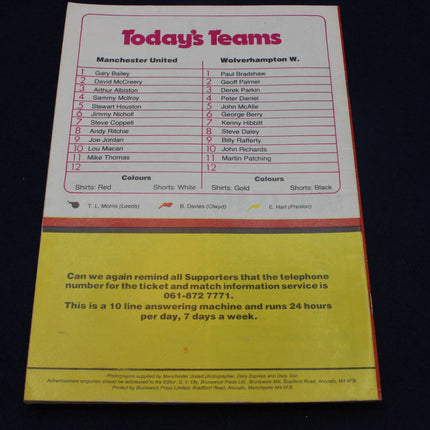 Matchday programme for Manchester United vs Wolverhampton Wanderers with team list and contact information.