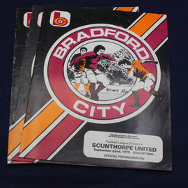 Bradford City football club programme on a dark background