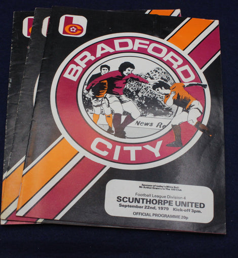 Bradford City football club programme on a dark background