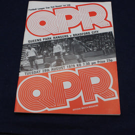 Vintage Queens Park Rangers match magazine cover with black and white photo of players on a dark background