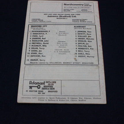 Back of a sports card with text and logos on a black background