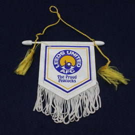 Leeds United AFC mini banner with tassels on a dark background