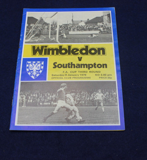 Vintage football programme for Wimbledon vs Southampton match on a dark background