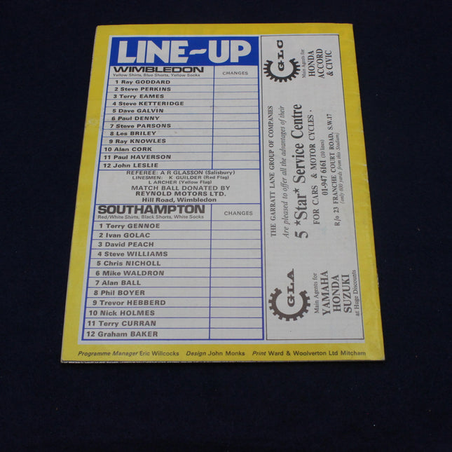 Sports event line-up card with player names on a yellow background