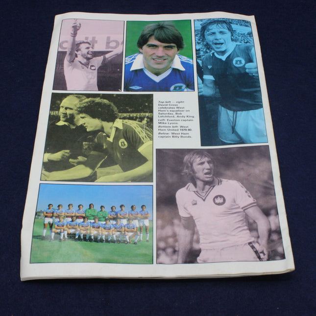 Football programme with black and white and color photos of soccer players and teams on a dark blue background.