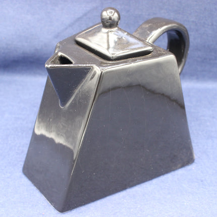 Black Tea Pot on a blue background
