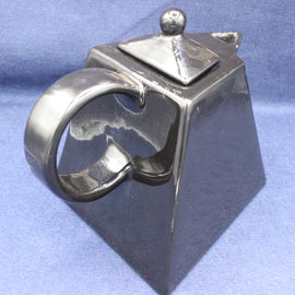 Black Tea Pot with a unique design on a blue background